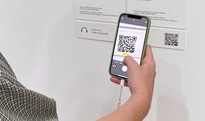 A visitor using QRT code at a tourist site