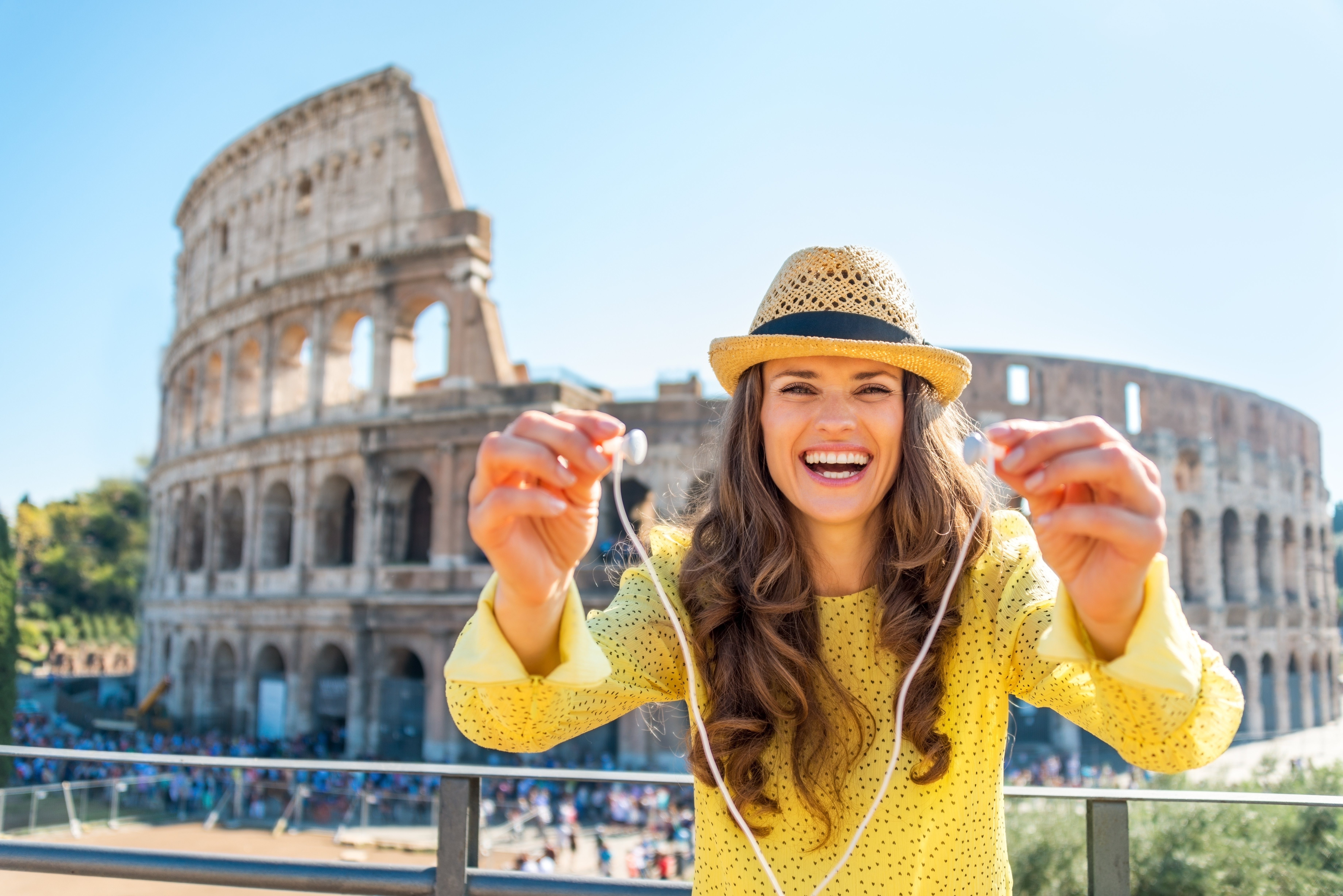 A traveller enjoying Rome with Audio Guide on her phone