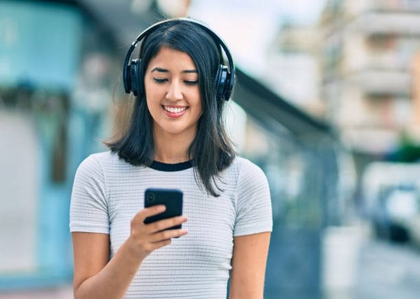 A girl using digital audio guide - Conventional vs. digital audio guides - Whats the best audio guide option for your visitors 01