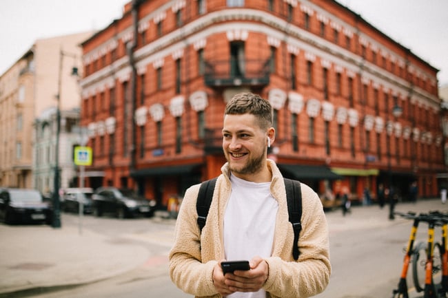 A European tourist using SmartGuide Digital audio guide on his mobile phone