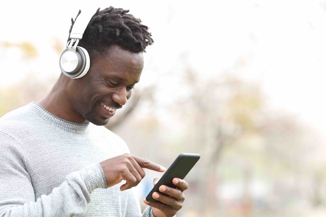 A visitor completely absorbed in SmartGuide AI-driven travel guide content