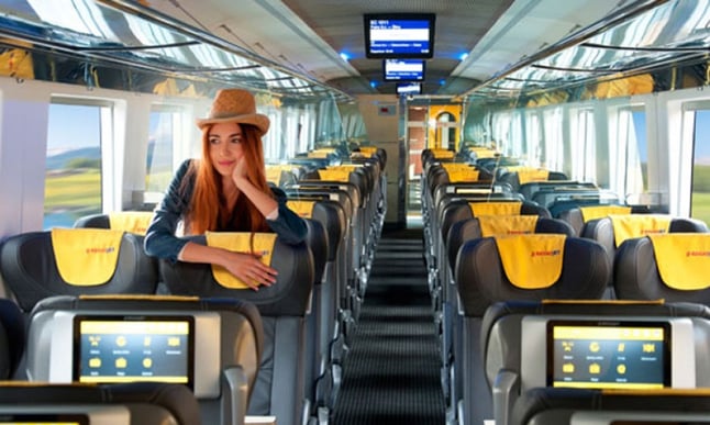 Passenger sitting in RejioJet train from Croatia to Prague